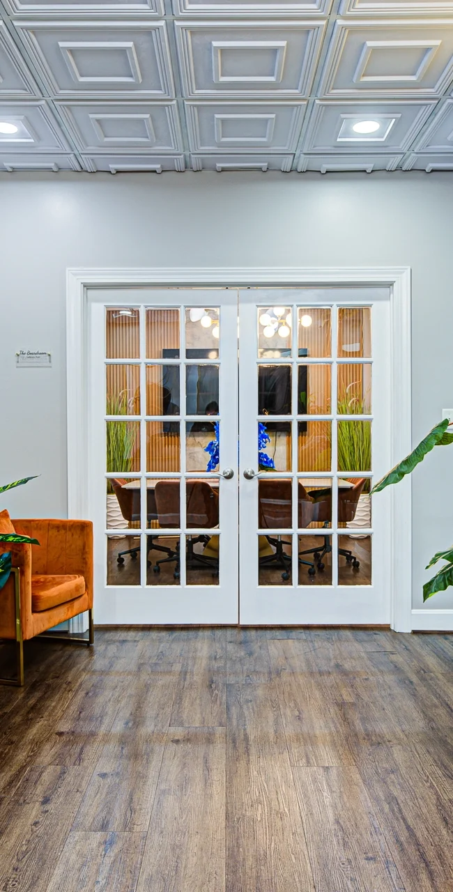 Professional workspace where a business owner works in a modern private office environment